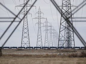 Manitoba Hydro power lines are photographed just outside Winnipeg on May 1, 2018. Manitoba Hydro has asked to the courts to overturn a order directing the Crown to create a special rate class for residential customers on First Nations reserves. The Public Utilities Board ordered Hydro to freeze rates on reserves for 2018-19 in May, while implementing a general rate increase of 3.6 per cent elsewhere.