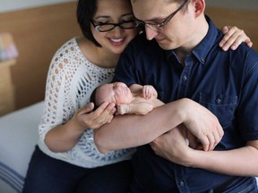 An Alberta MP has posted a touching online tribute following the death of his newborn daughter from a genetic disorder. Kmiec and his wife Evangeline hold their daughter Lucy-Rose in an undated handout photo.