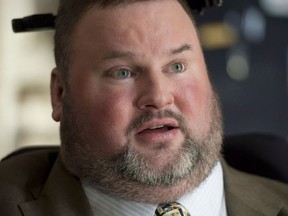 MP Steven Fletcher speaks with the media on Parliament Hill in Ottawa on March 26, 2014. A Manitoba politician is facing some heat after calling his former home room teacher hot. Steven Fletcher, an independent member of the legislature, posted a message on Twitter in reply to a woman who had taught him in Grades 7 and 8.