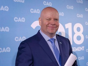 Former Montreal police inspector Ian Lafreniere wincks at his family as he announces his candidacy in the South Shore of Montreal riding of Vachon in Longueuil, Que., on August 21, 2018. Coalition Avenir Quebec Leader Francois Legault is considering whether to offer police protection to one of his candidates who recently received threats. Legault says ex-Montreal police spokesman Ian Lafreniere needs to be protected.