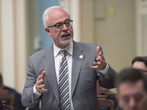 Quebec Finance Minister Carlos Leitao responds to the Opposition during question period, Tuesday, June 12, 2018 at the legislature in Quebec City. Leitao says protectionist measures of the Trump administration are already being felt on the ground in the province.