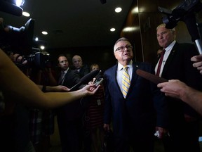 Creating a federal e-safety czar could help focus the uphill struggle to protect children from the rising threat of online sexual exploitation, frontline agencies have told the government. Public Safety and Emergency Preparedness Minister Ralph Goodale arrives to appear as witnesses at a House of Commons standing committee in Ottawa on Tuesday, July 24, 2018. Minister of Border Security and Organized Crime Reduction Bill Blair, right, looks on.