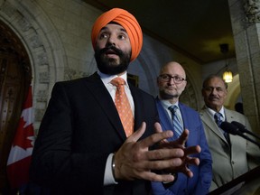 With threats of devastating U.S. tariffs hanging over the auto sector, Canada's economic development minister says Ottawa is considering every possible way it could respond if the Trump administration follows through on its warning. Minister of Innovation, Science and Economic Development Navdeep Bains makes an announcement in the Foyer of the House of Commons on Parliament Hill in Ottawa on Tuesday, June 19, 2018.
