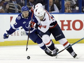 Washington Capitals center Chandler Stephenson (18) breaks out past Tampa Bay Lightning center Yanni Gourde (37) during the third period of Game 1 of the NHL Eastern Conference finals hockey playoff series Friday, May 11, 2018, in Tampa, Fla. Stephenson knew at the beginning of playoffs that he wanted to bring the Stanley Cup to Humboldt if he and the Washington Capitals won it.