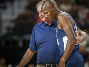 In this Friday, Aug. 10, 2018, photo, former UConn head basketball coach Jim Calhoun wraps his arm around former UConn and NBA star Ray Allen during Connecticut's alumni basketball game in Uncasville, Conn. Calhoun, who hosted the biannual charity game, believes the UConn program remains championship caliber.