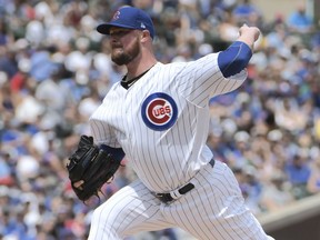 Chicago Cubs starting pitcher Jon Lester (34) throws the ball against the San Diego Padres during the first inning of a baseball game, Sunday, Aug. 5, 2018, in Chicago.