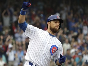 Chicago Cubs' Ben Zobrist celebrates after hitting the game-winning RBI single against the New York Mets during the 11th inning of a baseball game Wednesday, Aug. 29, 2018, in Chicago. The Cubs won 2-1. This game had been suspended in a 1-1 tie in the 10th inning due to severe weather conditions the night before.