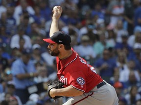 Washington Nationals starting pitcher Tanner Roark throws against the Chicago Cubs during the first inning of a baseball game Saturday, Aug. 11, 2018, in Chicago.