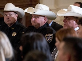 Sheriffs attend an event to salute U.S. Immigration and Customs Enforcement (ICE) officers and U.S. Customs and Border Protection (CBP) agents in the East Room of the White House in Washington, Monday, Aug. 20, 2018.