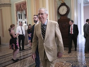 Senate Majority Leader Mitch McConnell, R-Ky., arrives at the chamber to begin work on a judicial confirmation, at the Capitol in Washington, Thursday, Aug. 16, 2018.