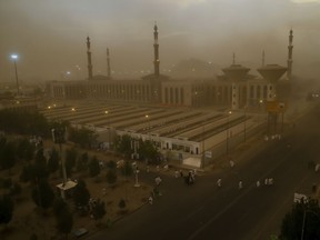 A sand storm engulfs Muslim pilgrims as they arrive at Namirah Mosque on Arafat Mountain, during the annual hajj pilgrimage, outside the holy city of Mecca, Saudi Arabia, Sunday, Aug. 19, 2018. More than 2 million Muslims have begun the annual hajj pilgrimage, representing one of the five pillars of Islam and is required of all able-bodied Muslims once in their life.