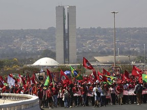 Supporters of Brazil's former president Luiz Inacio Lula da Silva begin their Free Lula March, in Brasilia, Brazil, Tuesday, Aug. 14, 2018. Thousands of supporters of the jailed leader and a current presidential candidate, are in Brasilia to monitor the registration of Lula's presidential candidacy, which will be held tomorrow by the Workers' Party in the Superior Electoral Court.