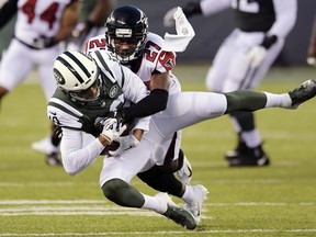 Atlanta Falcons cornerback Damontae Kazee (27) tackles New York Jets' Jermaine Kearse (10) during the first half of a preseason NFL football game Friday, Aug. 10, 2018, in East Rutherford, N.J.