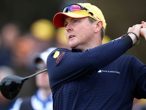 In this Nov. 14, 2013 file photo, Jarrod Lyle tees off during the first round of the Australian Masters golf tournament in Melbourne.