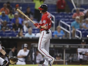 Washington Nationals' Trea Turner reacts after being hit by the ball during an at-bat in the third inning of a baseball game against the Miami Marlins, Sunday, July 29, 2018, in Miami.