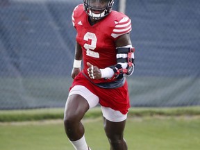 In this, Tuesday, Aug. 21, 2018 photo, Florida Atlantic linebacker Azeez Al-Shaair runs through drills during football practice in Boca Raton, Fla. Al-Shaair could use an NFL paycheck. But the nation's fifth-leading tackler from last season is back in school for his senior season, now essentially raising two of his brothers, remaining devout in his Muslim faith and believing that the struggles of growing up homeless have somehow made him a better football player.