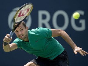 Grigor Dimitrov of Bulgaria makes a return to Frances Tiafoe of the USA during Rogers Cup tennis tournament action in Toronto on Thursday August 9, 2018.