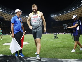 Germany's Robert Harting leaves the field after the men's discus throw final at the European Athletics Championships at the Olympic stadium in Berlin, Germany, Wednesday, Aug. 8, 2018.