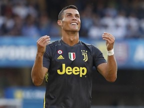 Juventus' Cristiano Ronaldo runs with the ball during the Serie A soccer match between Chievo Verona and Juventus, at the Bentegodi Stadium in Verona, Italy, Saturday, Aug. 18, 2018.