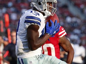 Dallas Cowboys wide receiver Michael Gallup, foreground, catches a touchdown pass in front of San Francisco 49ers defensive back Jimmie Ward during the first half of an NFL preseason football game in Santa Clara, Calif., Thursday, Aug. 9, 2018.