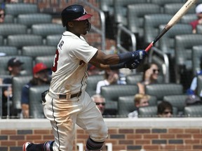 Atlanta Braves' Ronald Acuna Jr. doubles on a line drive to left field for a two run RBI during the sixth inning of the first game in a baseball doubleheader Monday, Aug. 13, 2018, in Atlanta.