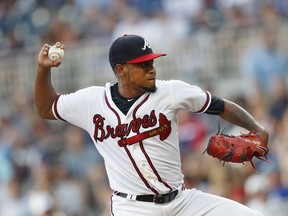 Atlanta Braves starting pitcher Julio Teheran works in the first inning of a baseball game against the Milwaukee Brewers, Saturday, Aug. 11, 2018 in Atlanta.