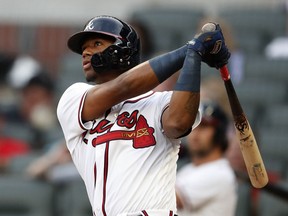 Atlanta Braves' Ronald Acuna Jr. (13) follows through on a lead-off home run in the first inning of a baseball game against the Miami Marlins Tuesday, Aug. 14, 2018 in Atlanta.