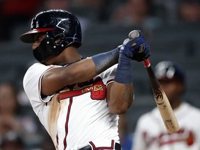 Atlanta Braves left fielder Ronald Acuna Jr. (13) drives in a run with a single in the sixth inning of the second baseball game of a doubleheader against the Miami Marlins Monday, Aug. 13, 2018 in Atlanta. There Braves won 6-1.