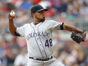 Colorado Rockies starting pitcher German Marquez (48) delivers in the first inning of a baseball game against the Atlanta Braves, Sunday, Aug. 19, 2018, in Atlanta.