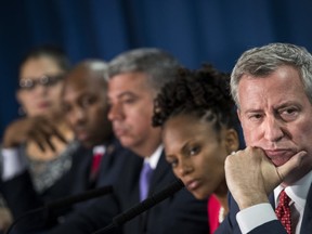 New York City Mayor Bill de Blasio looks on during a news conference to announce a new policy that officials say will reduce unnecessary marijuana arrests.