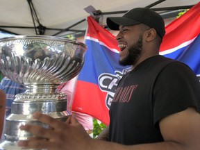 Devante Smith-Pelly brought the Stanley Cup to the Black Dog Pub in Scarborough, Ont., on Monday. At some point during Smith-Pelly's day with the Cup, a dog ended up perched atop it.