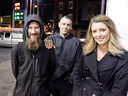 Johnny Bobbitt Jr., left, Kate McClure, right, and McClure's boyfriend Mark D'Amico pose at a Citgo station in Philadelphia on Nov. 17, 2017.