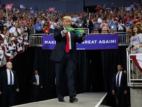 President Donald Trump arrives to speak at a campaign rally at the Ford Center, Thursday, Aug. 30, 2018, in Evansville, Ind.