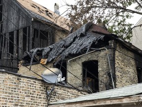 This shows a tattered home Wednesday, Aug. 29, 2018, after a deadly fire early Sunday. The deadliest residential fire in years in Chicago claimed its tenth and final victim on Tuesday, as a boy who barely survived the blaze died at a hospital.