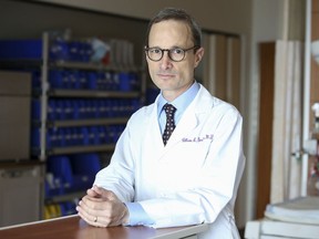 In this Aug. 7, 2018 photo, Dr. William Grobman stands for a portrait at Prentice Women's Hospital/Northwestern Medicine in Chicago. Having an induced pregnancy doesn't mean moms can't have "natural childbirth" _ they can forgo pain medicine or use a hospital's homelike birthing center rather than delivering in "an operating room in a sterile suite with a big light over your head," says Grobman.