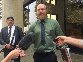 Sasquatch tracker Todd Standing speaks to reporters Tuesday after his court appearance in B.C. Supreme Court in New Westminster.