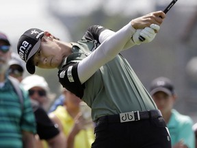 Sung Hyun Park, of South Korea, tees off on the first hole during the final round of the Indy Women in Tech Championship golf tournament, Sunday, Aug. 19, 2018, Indianapolis.