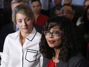 Liberal MP Iqra Khalid, right, seen in a file photo from Feb. 15, 2017, with cabinet minister Mélanie Joly, has apologized for presenting a volunteer award to a spokesman for a Palestinian organization that was defunded by the federal government six years ago for links to extremists.