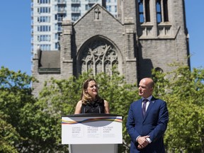 Foreign Affairs Minister Chrystia Freeland speaks at a press conference in Vancouver, B.C. on Monday, August 6, 2018 as MP Randy Boissonnault looks on.