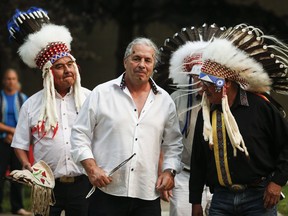 Former professional wrestling icon Bret Hart dances with native elders after receiving a Blackfoot name in a private ceremony at Mount Royal University in Calgary, Alta., Thursday, Aug. 23, 2018.THE CANADIAN PRESS/Jeff McIntosh