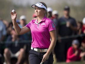 Brooke Henderson, of Smiths Falls, Ont. celebrates finishing her third round at the CP Women's Open in Regina, Saturday, August, 25, 2018. Henderson shot a 2-under-par 70 on Saturday to move into the lead at the CP Women's Open.