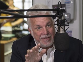 Quebec Liberal Leader Philippe Couillard during an interview at a local radio station in Roberval, Que., Monday, August 27, 2018.