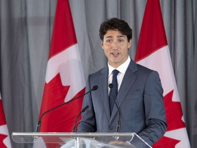 Prime Minister Justin Trudeau addresses a group of businessmen in Longueuil, Que. on Tuesday, August 28, 2018. He accused the Trump administration Wednesday of setting its sights on dismantling Canada’s supply management system.