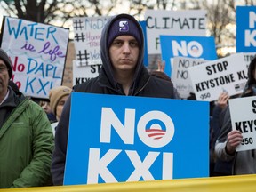 Opponents of the Keystone XL and Dakota Access pipelines hold a rally as they protest US President Donald Trump's executive orders advancing their construction, at Lafayette Park next to the White House in Washington, D.C., on January 24, 2017.