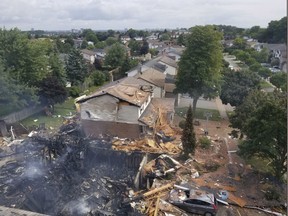 Debris is shown following a house explosion in Kitchener, Ont., on Wednesday, Aug. 22, 2018.