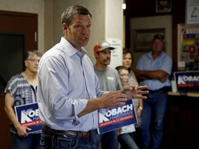 Kansas Secretary of State Kris Kobach and candidate for the Republican nomination for Kansas Governor addresses supporters during a campaign stop Friday, Aug. 3, 2018, at the Fort Scott Livestock Market in Fort Scott, Kan.