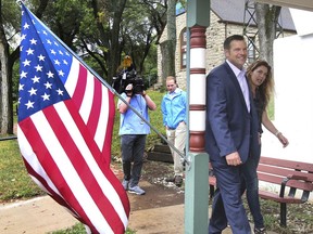 Kansas Secretary of State Kris Kobach and his wife Heather arrived to vote Tuesday morning, Aug. 7, 2018, at the Lecompton City Hall. Kobach is running for his party's nomination for governor.