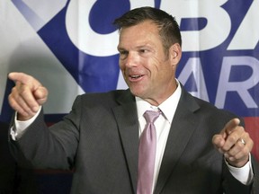 FILE - In this Aug. 8, 2018, file photo, Secretary of State Kris Kobach speaks to the media during a news conference at the Topeka Capitol Plaza hotel in Topeka, Kan. County election officials across Kansas are set to begin reviewing provisional ballots to arrive at final official vote totals in the tight Republican primary for governor.