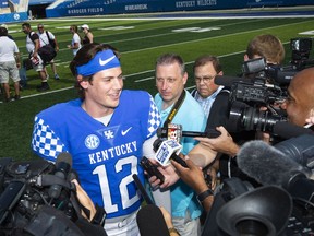 Sophomore quarterback Gunnar Hoak (12) answers questions from media members at the Kentucky NCAA college football media day at Kroger field in Lexington, Ky., Friday Aug 3, 2018.