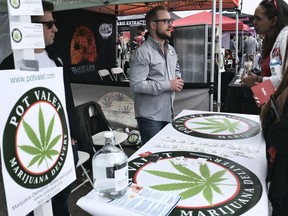 FILE - This March 31, 2018 photo shows a booth advertising a delivery service for cannabis at the Four Twenty Games in Santa Monica, Calif. Police chiefs and cities are working together to block a proposed state rule that they say would allow unchecked home marijuana deliveries anywhere in California, even into places that have banned cannabis sales. California Police Chiefs Association President David Swing says in a statement that the change would "open the floodgates" for potential criminal activity.